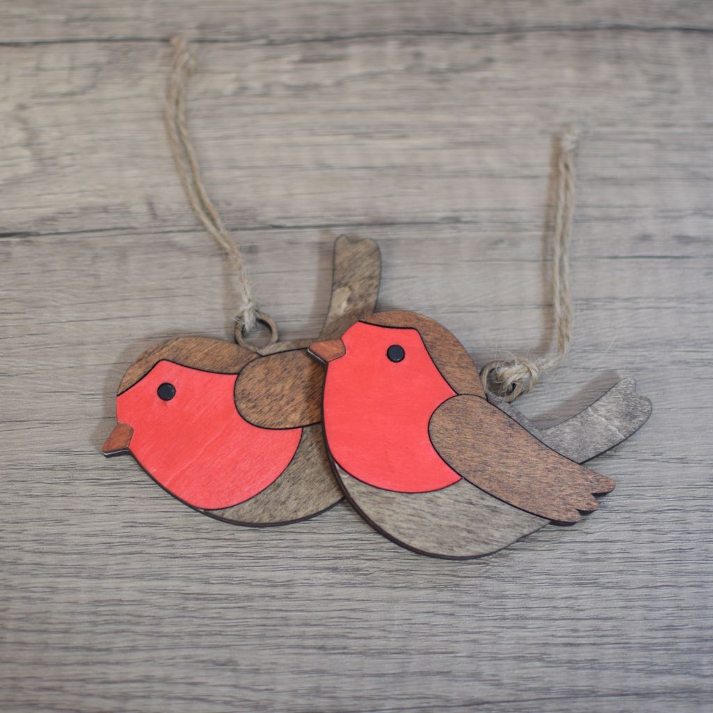 two wooden robin hanging decorations with jute twine
