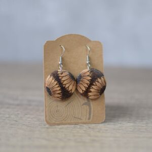 phot showing a pair of pyrography drop earrings
