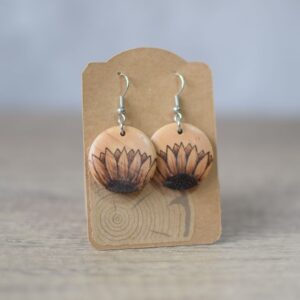 Photo of pyrography drop earrings with half sunflower design