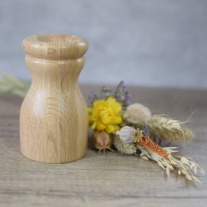 smaller oak twig vase next to a posy of dried flowers