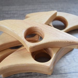A selection of large wooden book page holders used to help hold the pages of a book open while you are reading