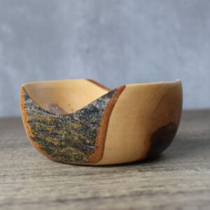 a small Ash wood turned decorative dish with a live edge bark feature